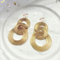 Orecchini Clip Lunghi a 3 Cerchi – Geometrici Oro Statement