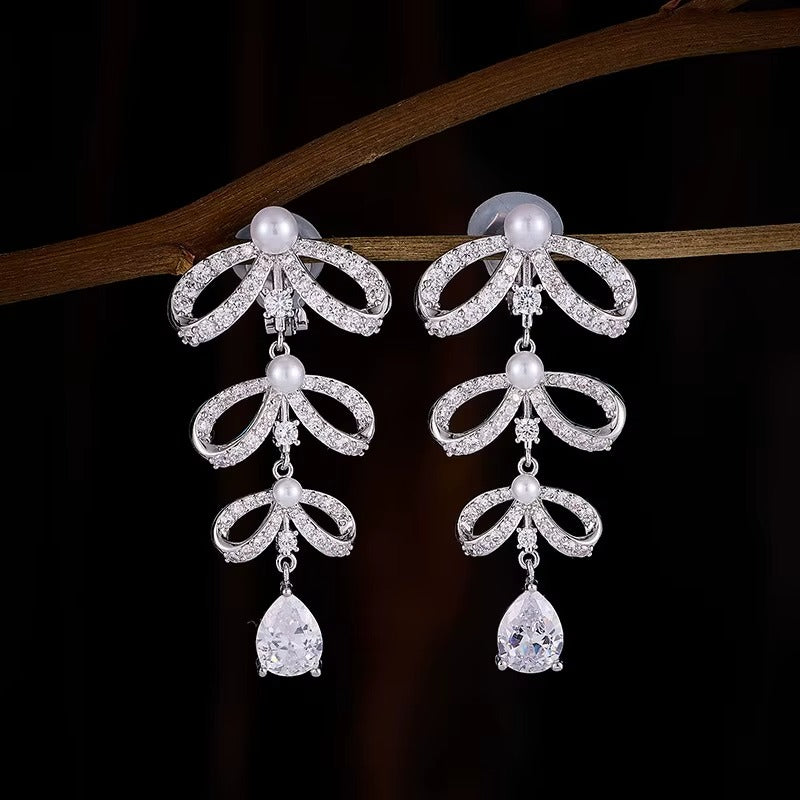 Orecchini Clip di Lusso con Perla Waterdrop e Nodo a Farfalla – Design Elegante Senza Fori